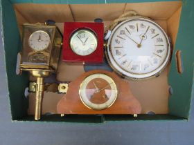 A TRAY CONTAINING A KIENZLE ZODIAC WALL CLOCK, QUARTZ NAUTICAL CLOCK, MANTLE CLOCK AND A SHATZ