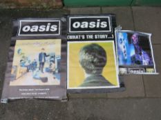 TWO LARGE OASIS POSTERS TOGETHER WITH A SMALLER OASIS POSTER - LARGEST APPROX 152 X 101.5 CM