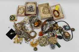 A BOX OF VINTAGE COSTUME JEWELLERY TO INCLUDE MIRACLE BROOCH ETC