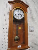 A MODERN HERMLE PENDULUM WALL CLOCK WITH KEY