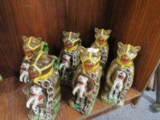 SIX REPRODUCTION NOVELTY JUGS IN THE FORM OF A CAGE BEAR HOLDING A FELINE