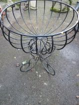 A WROUGHT IRON PLANTER GARDEN STAND