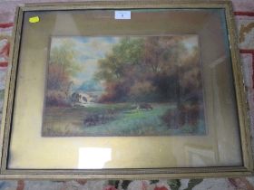 A FRAMED AND GLAZED WATERCOLOUR OF COWS GRAZING IN A FIELD, WATER MILL AND TREES BEYOND SIGNED F.