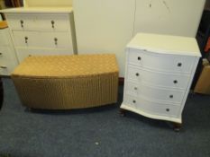 A WHITE PAINTED FOUR DRAWER SERPENTINE CHEST, COFFEE TABLE AND LLOYD LOOM LINEN BOX (3)