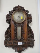 AN ANTIQUE HEAVILY CARVED WALL BAROMETER A/F