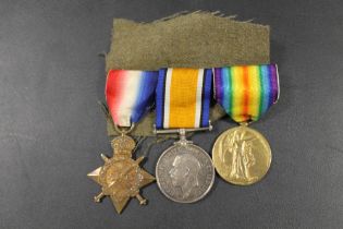 A WW1 MEDAL TRIO, 1914/15 STAR, BRITISH WAR MEDAL AND VICTORY. IMPRESSED NAMING - S-10165 PTE W.