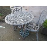 A CAST ALUMINIUM GARDEN TABLE SET TO INCLUDE TABLE, TWO CHAIRS AND PARASOL BASE