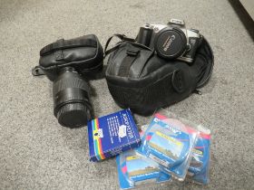 A CANNON CAMERA AND ACCESSORIES IN AN HP LAPTOP BAG