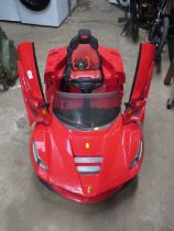 A RIDE ALONG CHILDS BATTERY FERRARI CAR WITH REMOTE - NO CHARGER