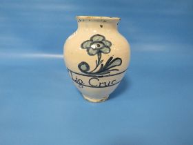 AN ANTIQUE DELFT DRUG JAR, INSCRIBED 'LIG. CRUC' WITH A FLOWER ABOVE H 19 CM