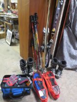 A LARGE SELECTION OF SKIING EQUIPMENT TO INCLUDE SKIS, SNOW SHOES AND BOOTS