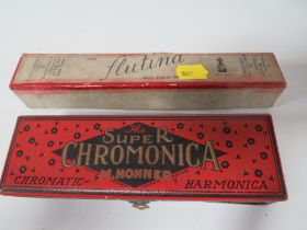 A BOXED HOHNER SUPER CHROME MONICA CHROMATIC HARMONICA TOGETHER WITH A BOXED FLUTINA FLUTE (2)