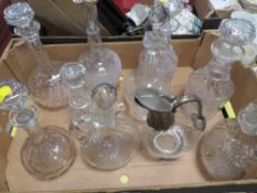 A TRAY OF ASSORTED DECANTERS TO INCLUDE A SILVER TOPPED EXAMPLE
