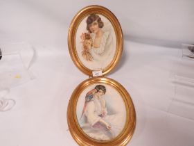 L. MITCHELL, A PAIR OF 1920'S WATERCOLOURS, ONE OF A LADY WITH A DOG, THE OTHER OF A LADY WITH A