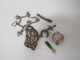 A SMALL BAG OF COLLECTABLE'S TO INCLUDE A SILVER CHARM BRACELET STAMPED STERLING, SMALL JADE PENDANT