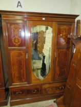 AN ANTIQUE MAHOGANY INLAID TRIPLE WARDROBE WITH CENTRAL MIRROR DOOR