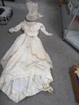 A BOX CONTAINING A VINTAGE WEDDING DRESS