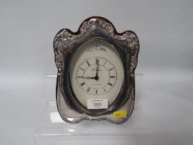 A HALLMARKED SILVER TABLE CLOCK