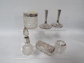 A COLLECTION OF SIX HALLMARKED SILVER DRESSING TABLE ITEMS TO INCLUDE BUD VASES