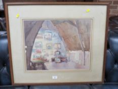 A FRAMED AND GLAZED WATERCOLOUR OF AN INTERIOR SCENE BY S.T.C.WEEKS, SIGNED LOWER RIGHT