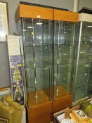 A PAIR OF MODERN SQUARE LIGHT-UP REVOLVING DISPLAY CABINETS WITH KEYS