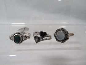 THREE DECORATIVE SILVER DRESS RINGS TO INCLUDE A MYSTIC TOPAZ STYLE EXAMPLE