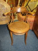 A VINTAGE 'THONET' BENTWOOD ARM CHAIR (LOOSE SEAT )