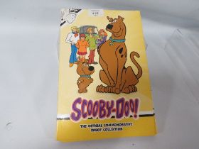 A FULL SET OF SCOOBY DOO OFFICIAL INGOTS IN COLLECTORS FOLDER