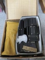 A SUITCASE CONTAINING A HEURTIER PROJECTOR TOGETHER WITH A SMALL BOX OF PRINTED SLIDES