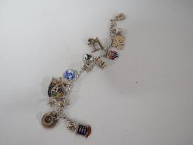 A VINTAGE SILVER CHARM BRACELET