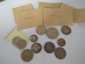 A SMALL TIN OF ENGLISH AND FOREIGN COINS