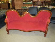 A REPRODUCTION MAHOGANY SHAPED UPHOLSTERED SETTEE