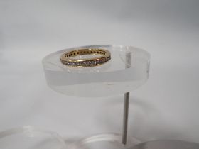 AN 18K CHANNEL SET DIAMOND FULL ETERNITY RING ring size n 1/2 approx weight 3.9g