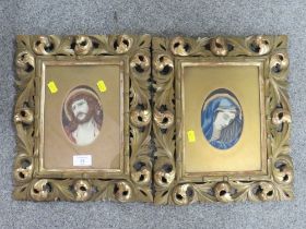 A PAIR OF GILT FLORENTINE STYLE FRAMES OF RELIGIOUS NEEDLEWORK STUDIES