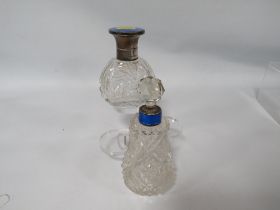 A HALLMARKED SILVER AND BLUE GUILLOCHE ENAMEL CUT GLASS SCENT BOTTLE TOGETHER WITH ANOTHER (2)