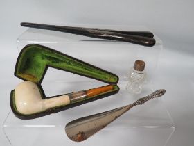 A SILVER MOUNTED MEERSCHAUM & AMBER PIPE, GLOVE STRETCHERS, SHOE HORN ETC