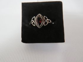 A DECORATIVE SILVER DRESS RING