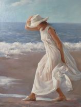 A MODERN FRAMED OIL ON CANVAS DEPICTING A LADY ON THE BEACH - SIGNED