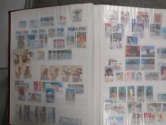 A LARGE COLLECTION OF STAMPS, ALBUMS, FIRST DAY COVERS CONTAINED IN ALBUMS