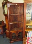 A COLONIAL STYLE CORNER CABINET