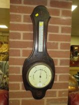 AN OAK VINTAGE BAROMETER