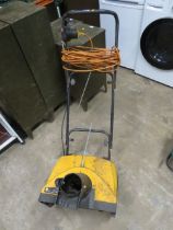 AN ELECTRIC SNOW THROWER MACHINE