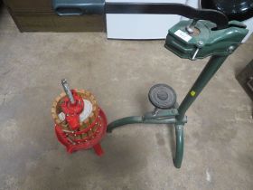 A FRUIT PRESS AND A FLOOR STANDING BOTTLE CORKER