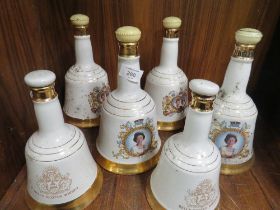 A SET OF SIX BELLS SCOTCH WHISKY DECANTERS