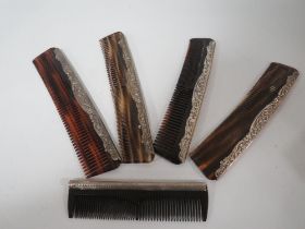 FIVE HALLMARKED SILVER BACKED COMBS