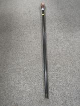 A REPRODUCTION WALKING CANE WITH A CARVED HANDLE