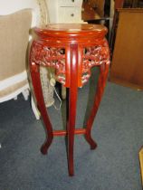 A MODERN EASTERN STYLE CARVED JARDINAIRE STAND