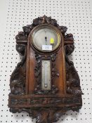 AN ANTIQUE HEAVILY CARVED WALL BAROMETER A/F