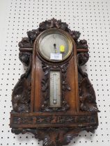 AN ANTIQUE HEAVILY CARVED WALL BAROMETER A/F