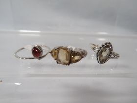 THREE ASSORTED SILVER DRESS RINGS